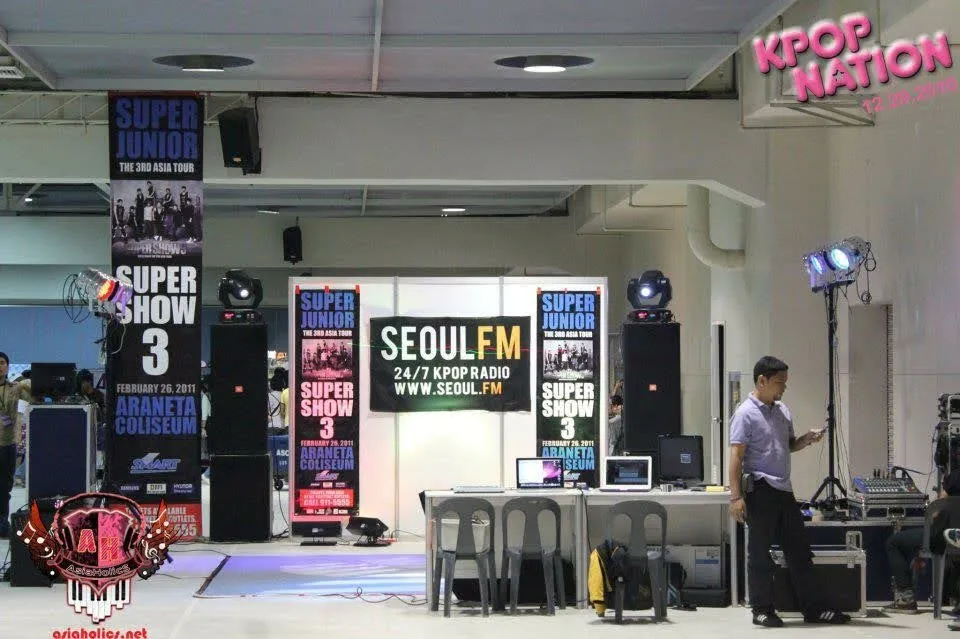 The SeoulFM booth at KPOP Nation in December 2010, with the posters for Super Junior’s Super Show 3